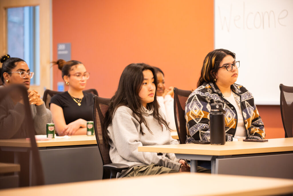 students sit in chairs and listen