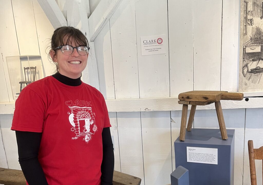 Maire O'Donnell ’23 with a historic stool at Old Sturbridge Village.