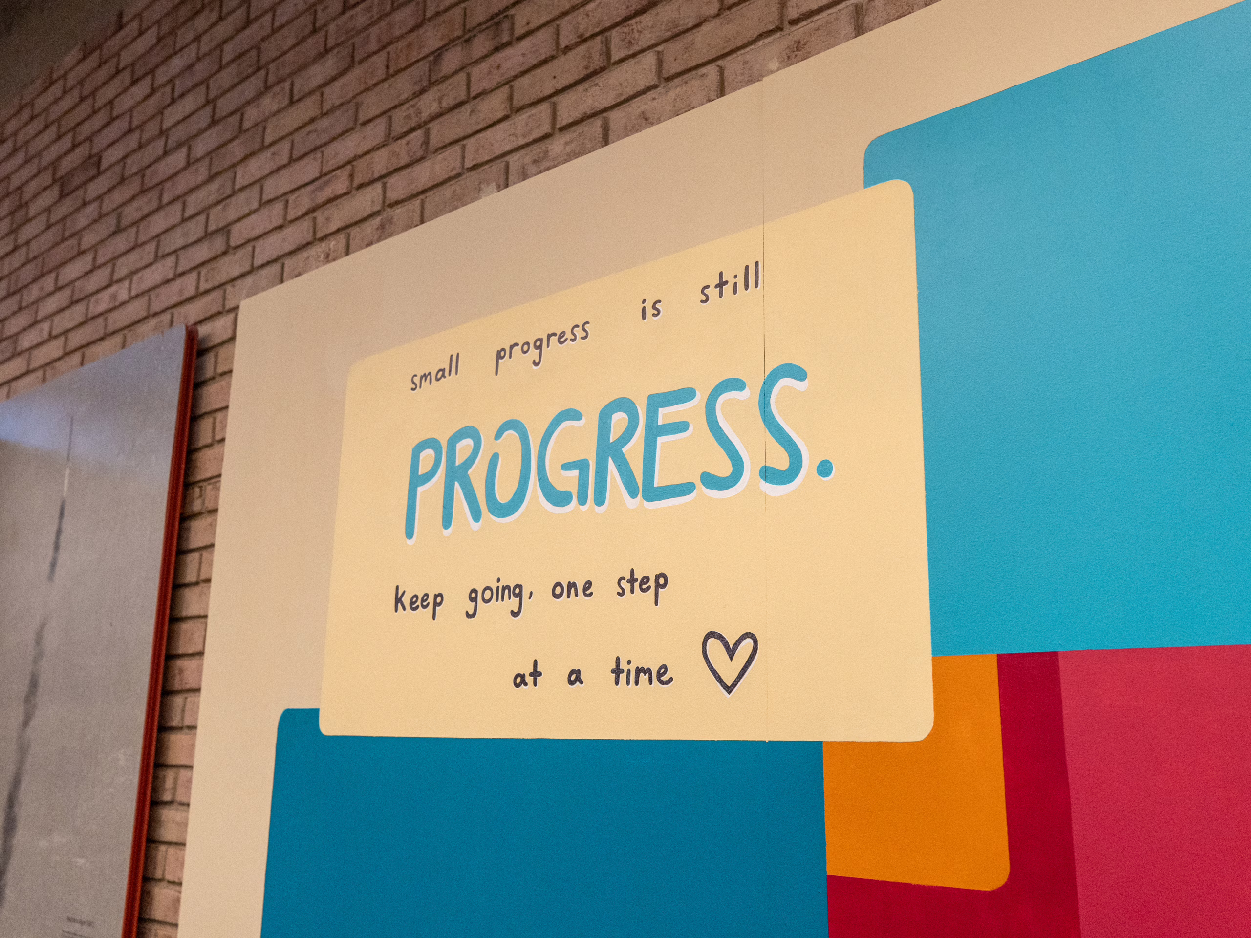 mural in library depicting woman studying