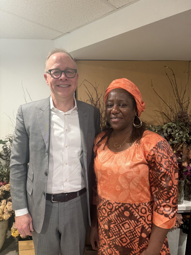 two people pose for photo