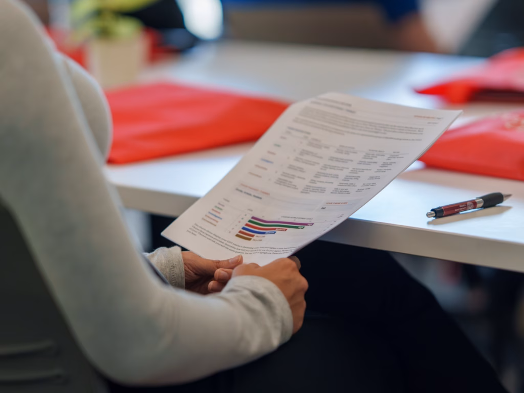 close-up of student holding assessment paperwork