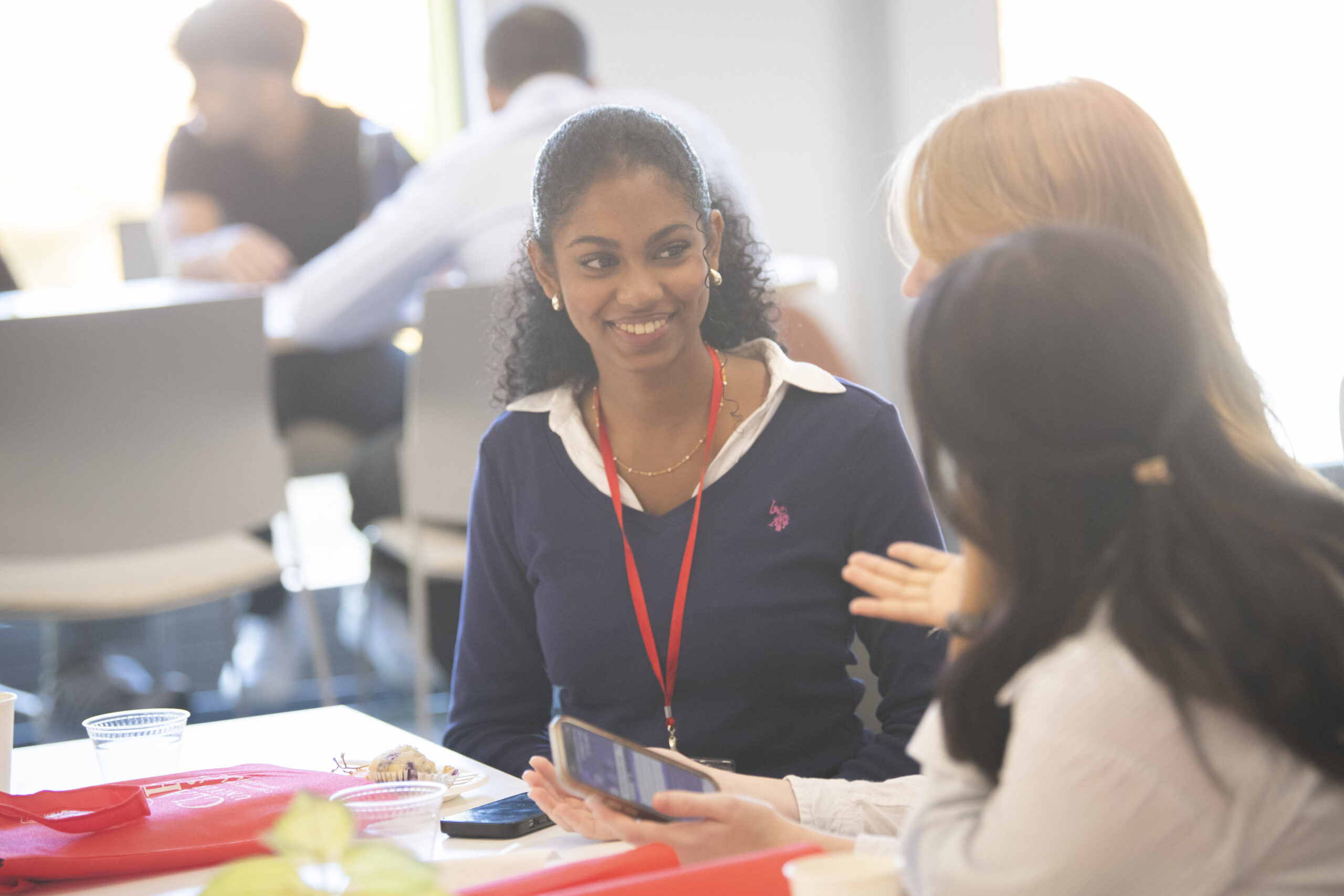 students talk at event