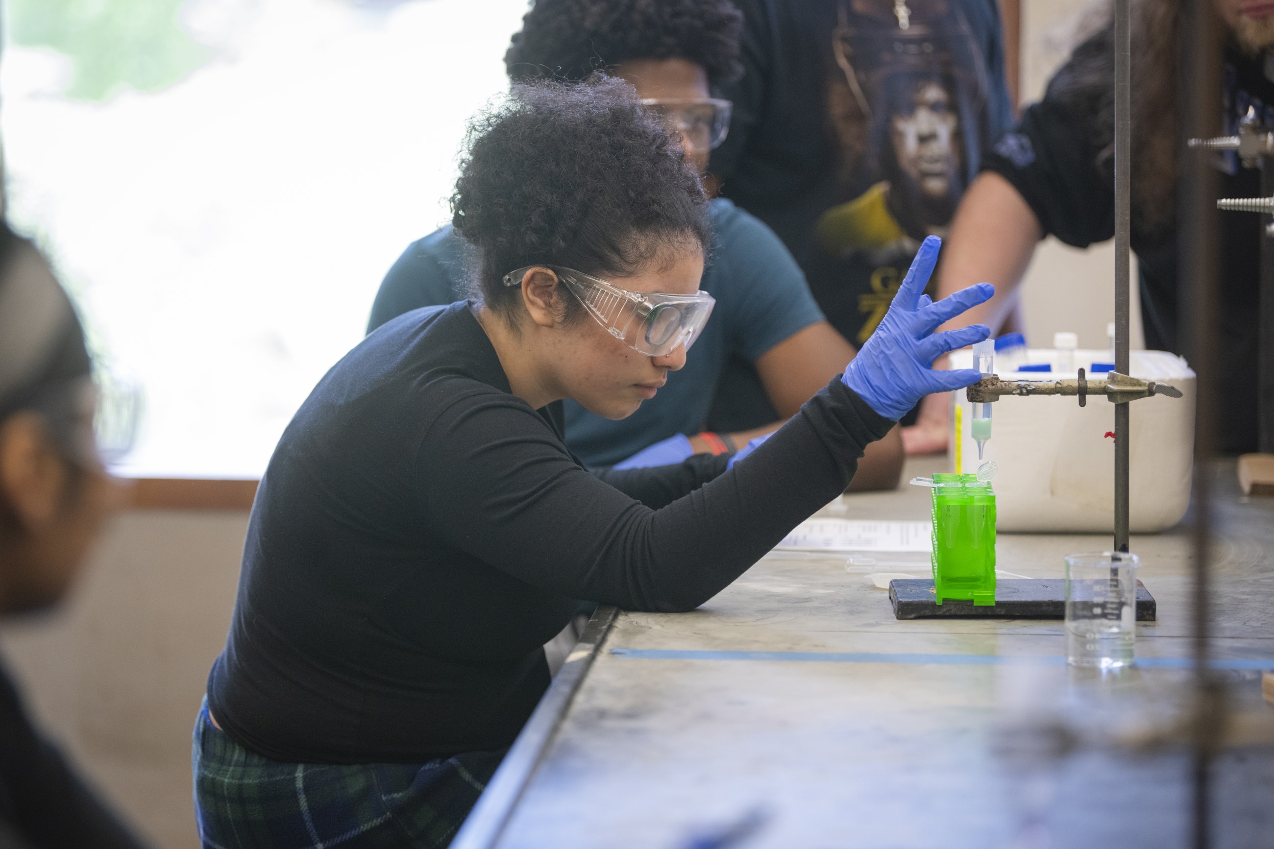 Worcester high school students conducting chemistry experiment at Clark