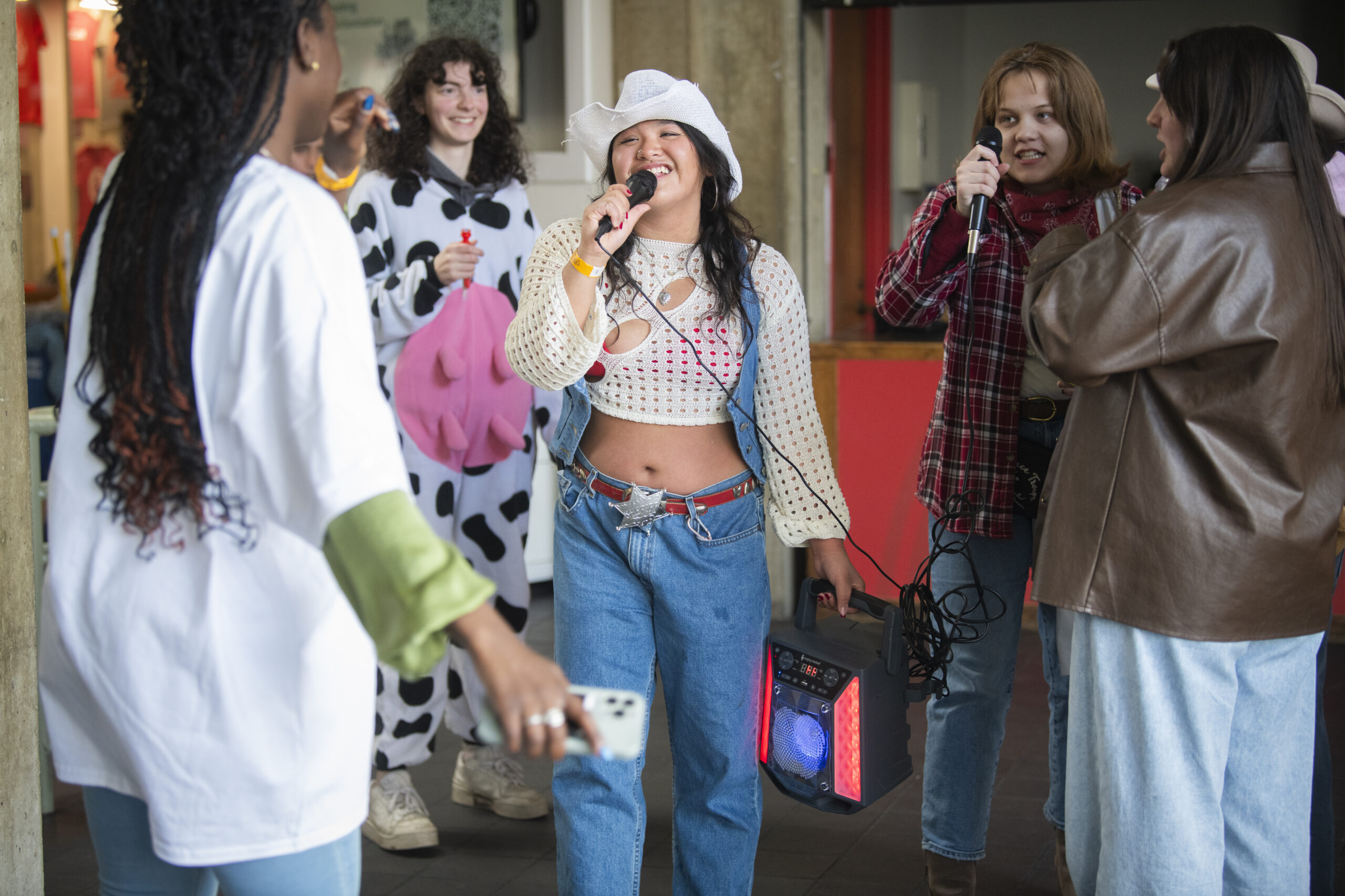 students sing karaoke