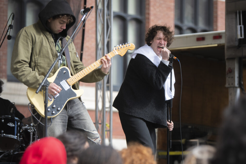 students perform on stage