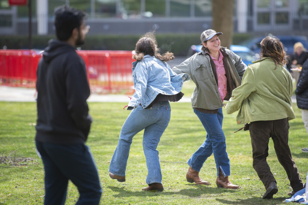 students celebrate on campus green