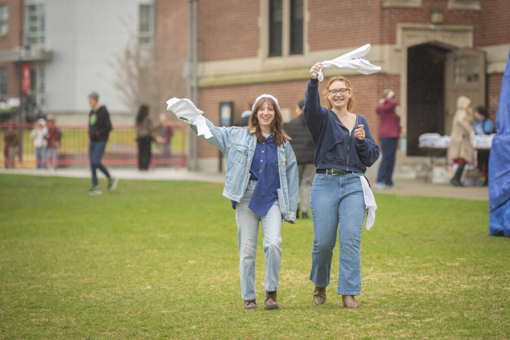 students celebrate on campus green
