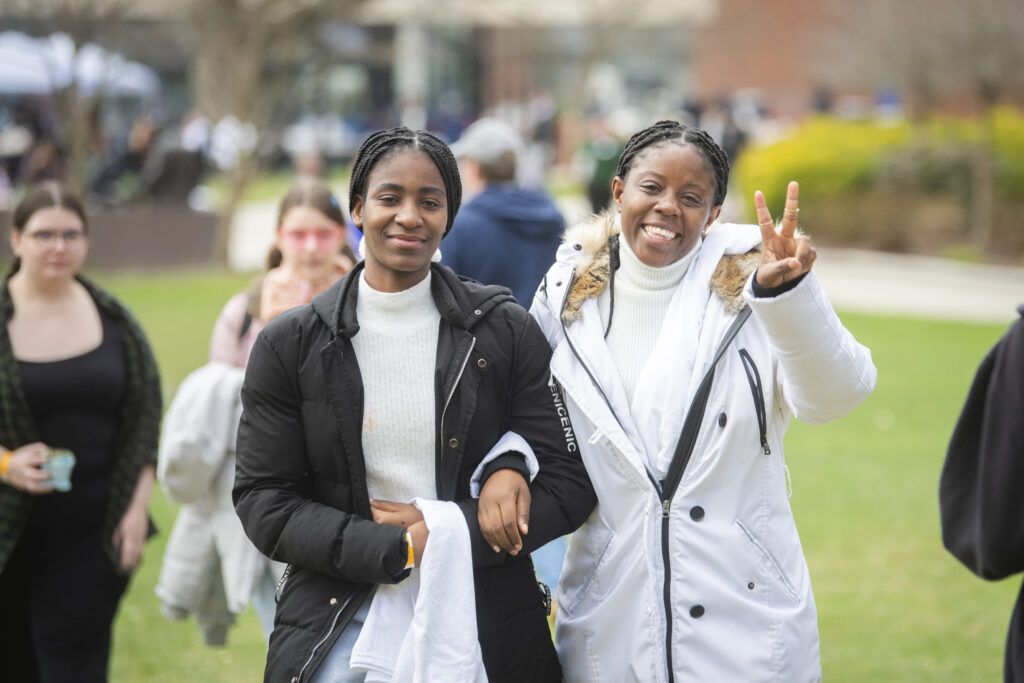 students celebrate on campus green