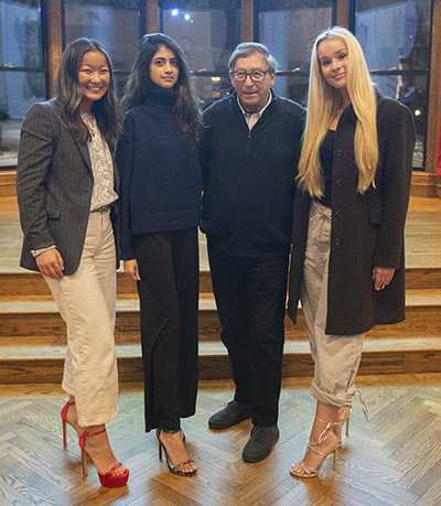 Stuart Weitzman with Clark students modeling his famous shoe designs.