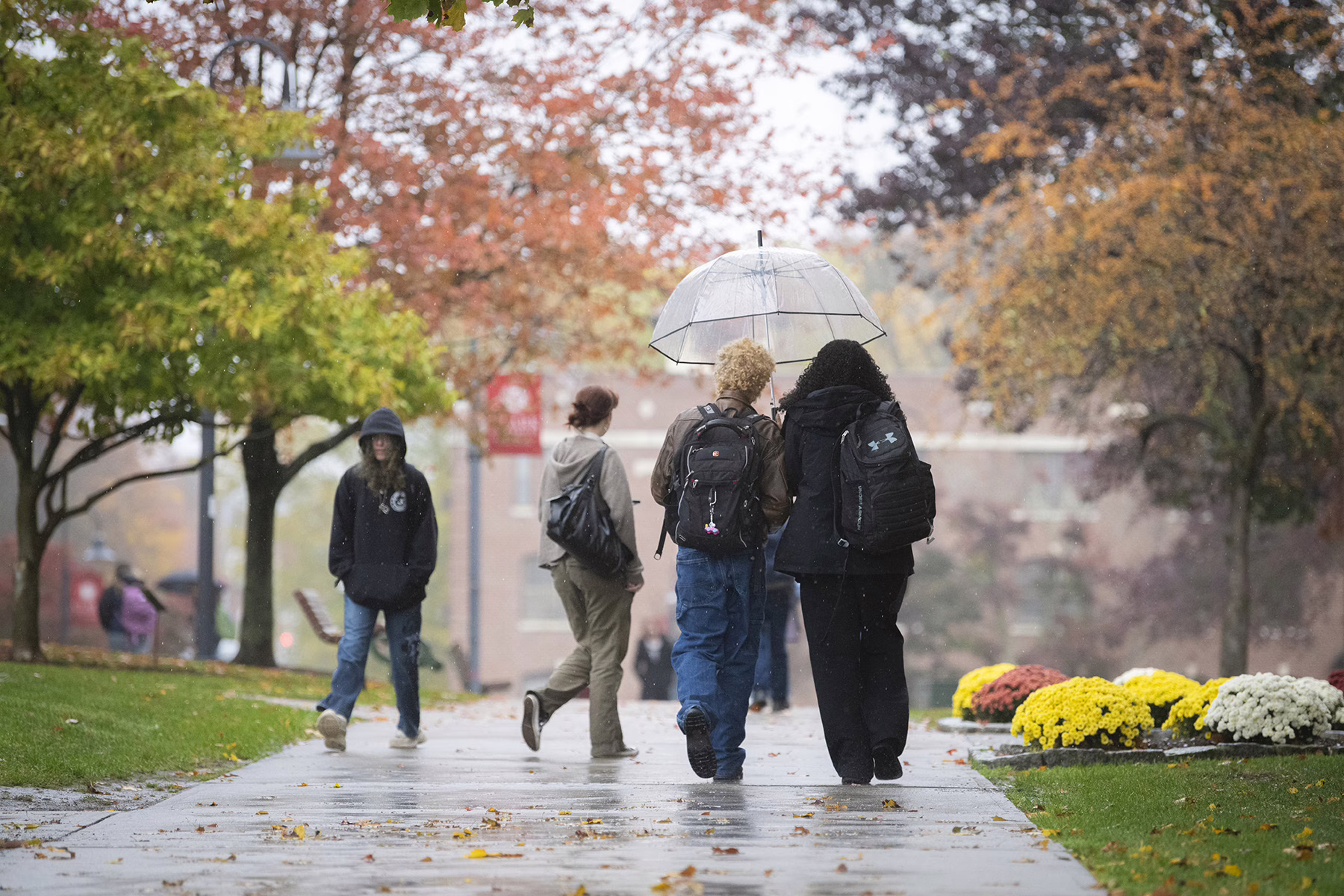 Students walking on Clark University campus in the fall