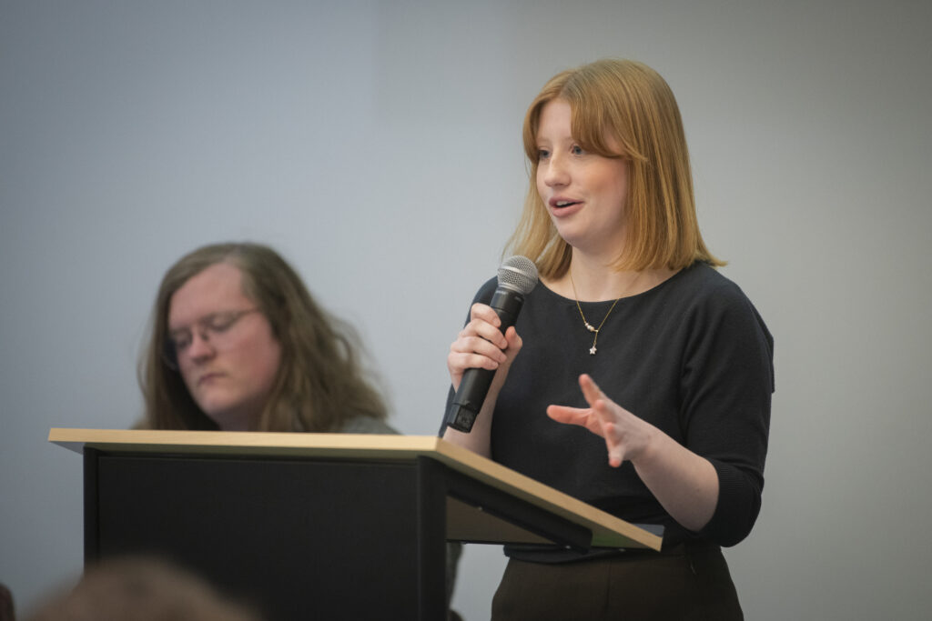 student speaks at podium