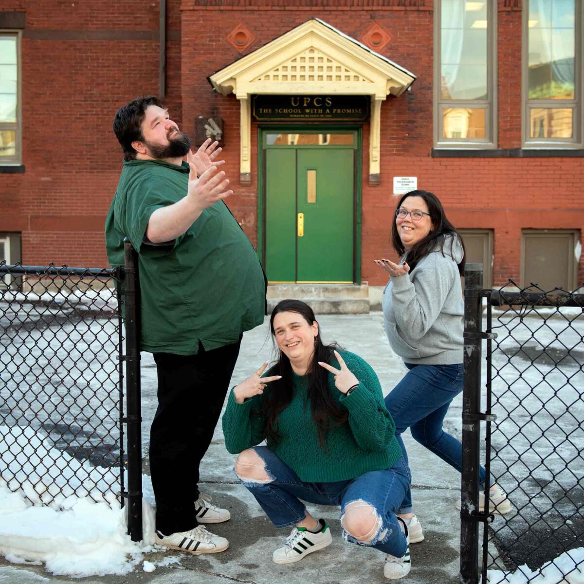Clark trained teachers, and siblings, Bill, Danielle, and Kim Surrette in front of the University Park Campus School