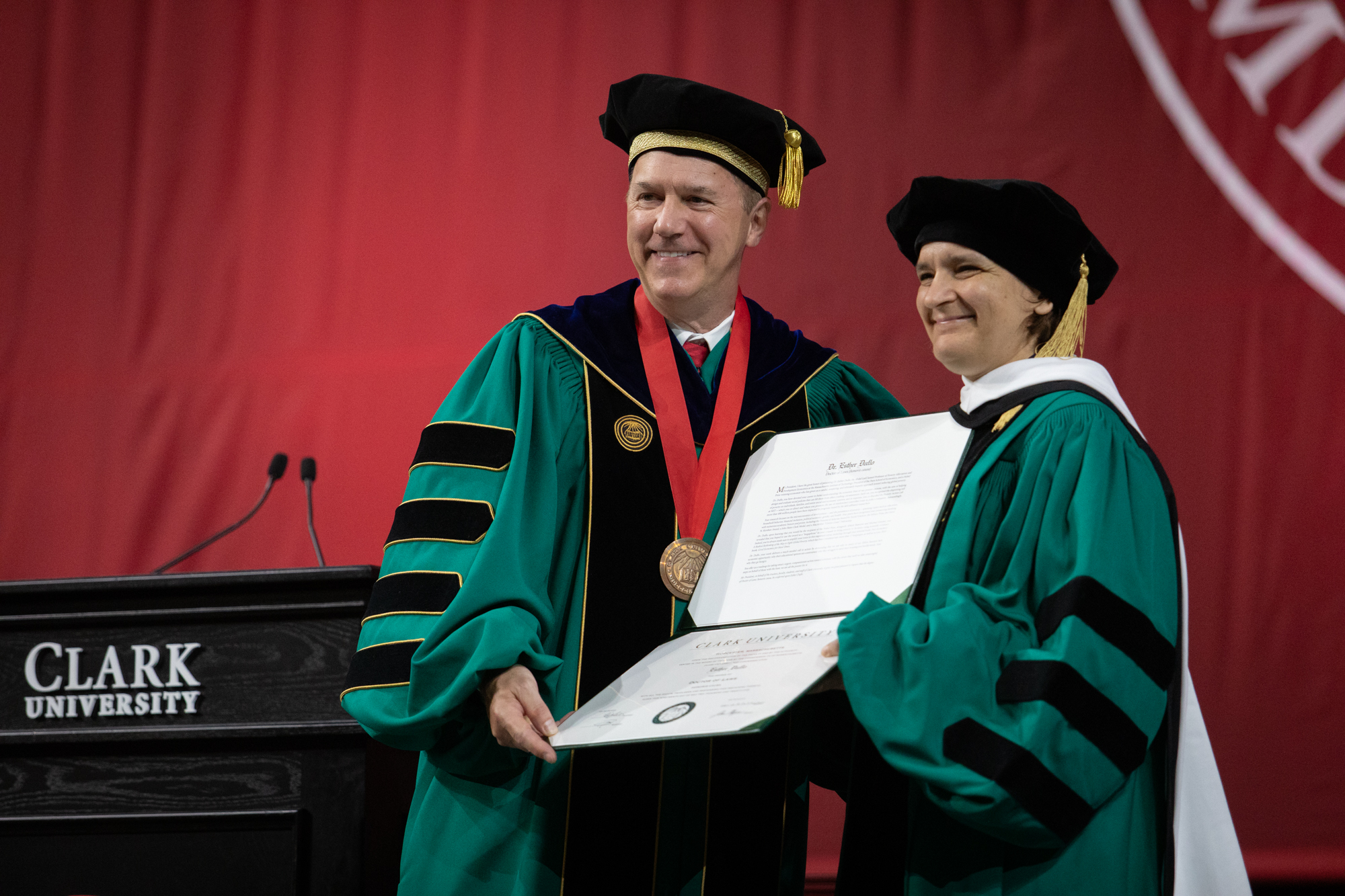 university president and commencement speaker pose for photo