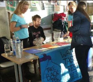 Students conduct a tap water taste test in the Higgins University Center
