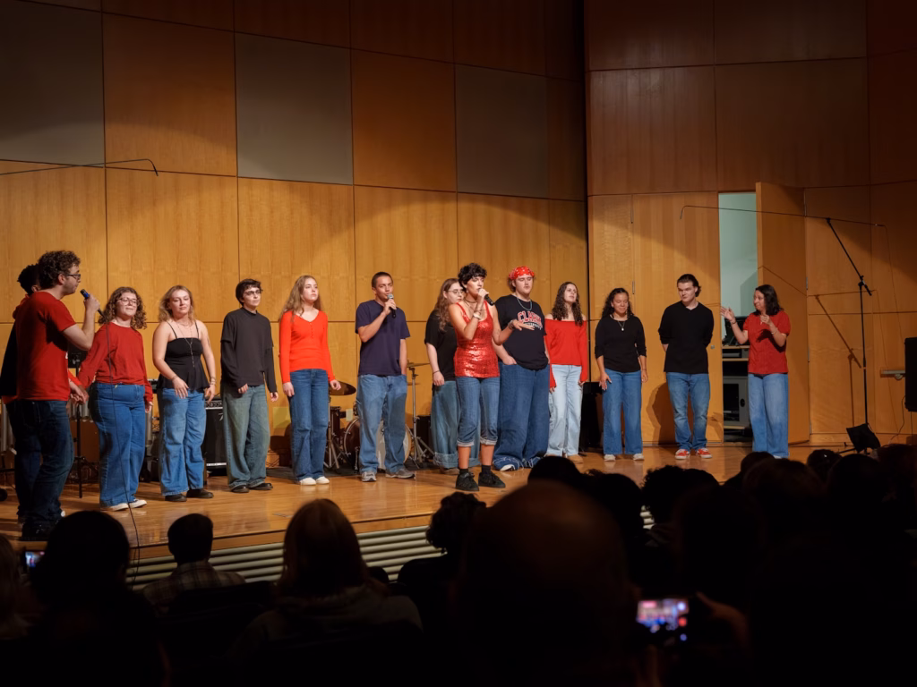 performing arts show with people singing on stage