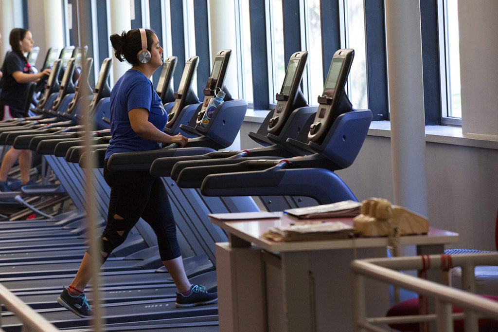 A student runs on the treadmill at the Clark University Bickman Fitness Center