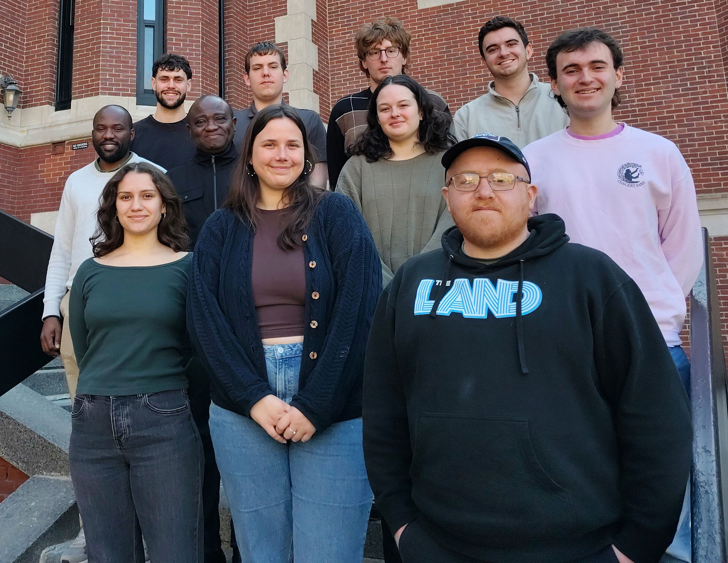 Front row, from left, Luna Pagan, ’27; Elise Beier ’25, M.S.-ES&P ’26; Robert Moore, Ph.D. student in environmental science and geography; second row, from left, Pacifique Madibi, M.S.-GIS ’26, Kalu Okigwe, M.S.-GIS ’26; Abigail Phillips ’26, M.S.-GIS ’27; and Zach Baranowski ’25, M.S.-GIS; back row, from left, Aaron Richmond-Crosset ’25, M.S.-GIS ’26; Daniel Neau ’27; Rowan Compton ’25, M.S.-GIS ’26; and Aidan Caron, Ph.D. student in geography. Not pictured: Rory Dickinson ’24, M.S.-GIS ’25.
