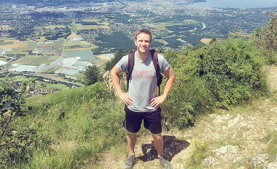 Aaron Johnson standing on a mountain above Geneva, Switzerland.