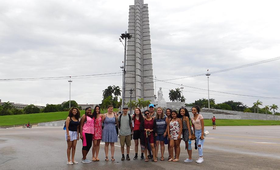 Crystal Hill and students in front of Memoria