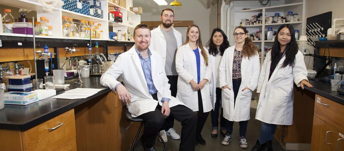From left, Donald Spratt and five of the 14 students currently working his lab: seniors Noah Schwaegerle, Roela Bardhi, Emlie Ogisu, Lara Prosterman and Pinky Htun.
