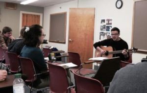 Clark University sophomore John Hite performs the Norberto Stuart poem "Mama Mártir" to a tune he composed. 
