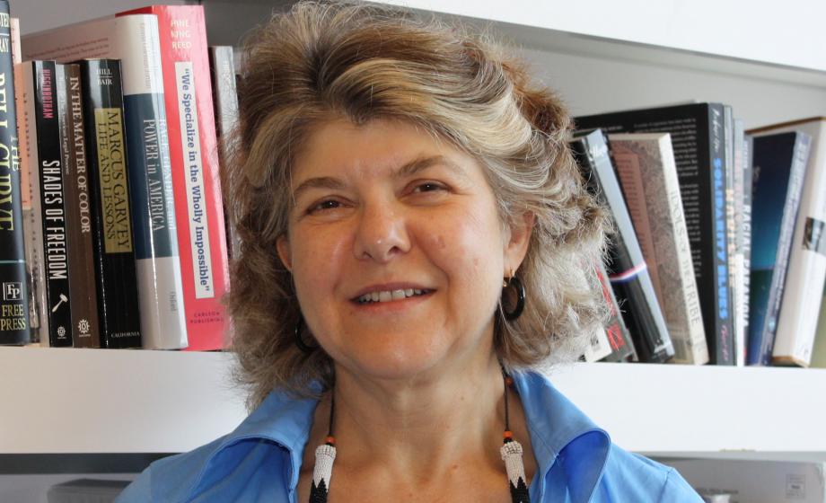 Jennifer Hochschild standing in front of bookshelve