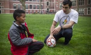 Mohamed Elmaola '18 with a boy