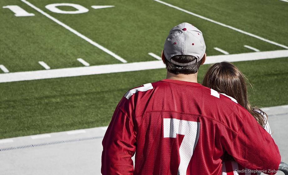 Parents watching college athlete event