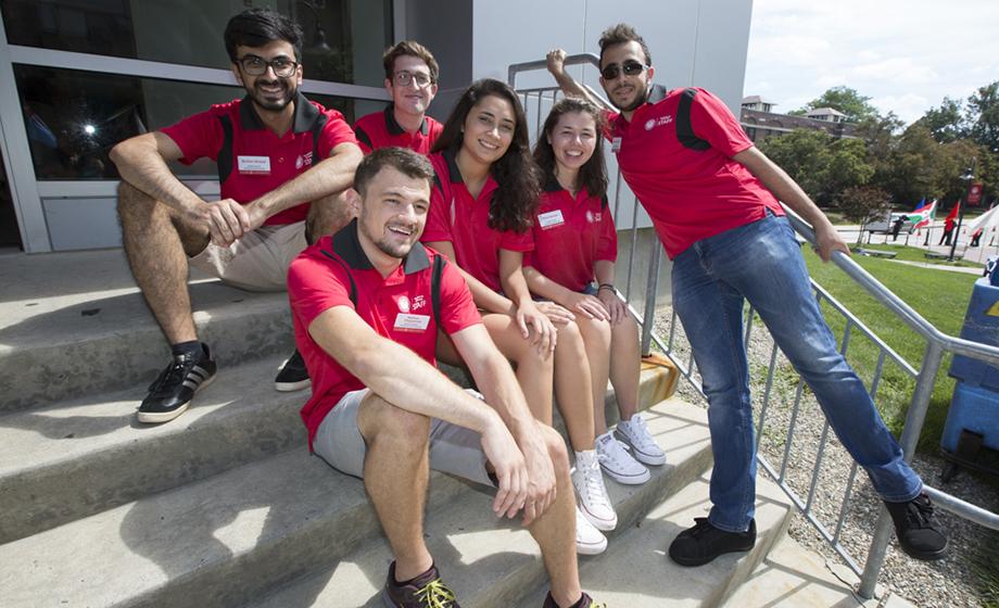 sutdents sitting on steps outsid