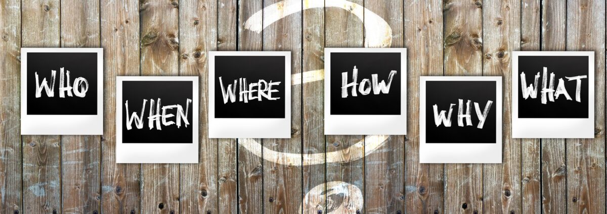 questions written on Polaroids