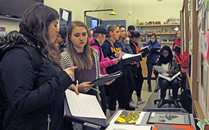 Sofia Noguer, second from left, views the exhibit with classmates.