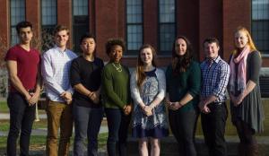 students standing infront of building
