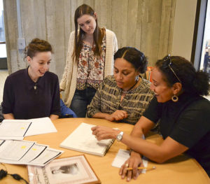 students looking over records