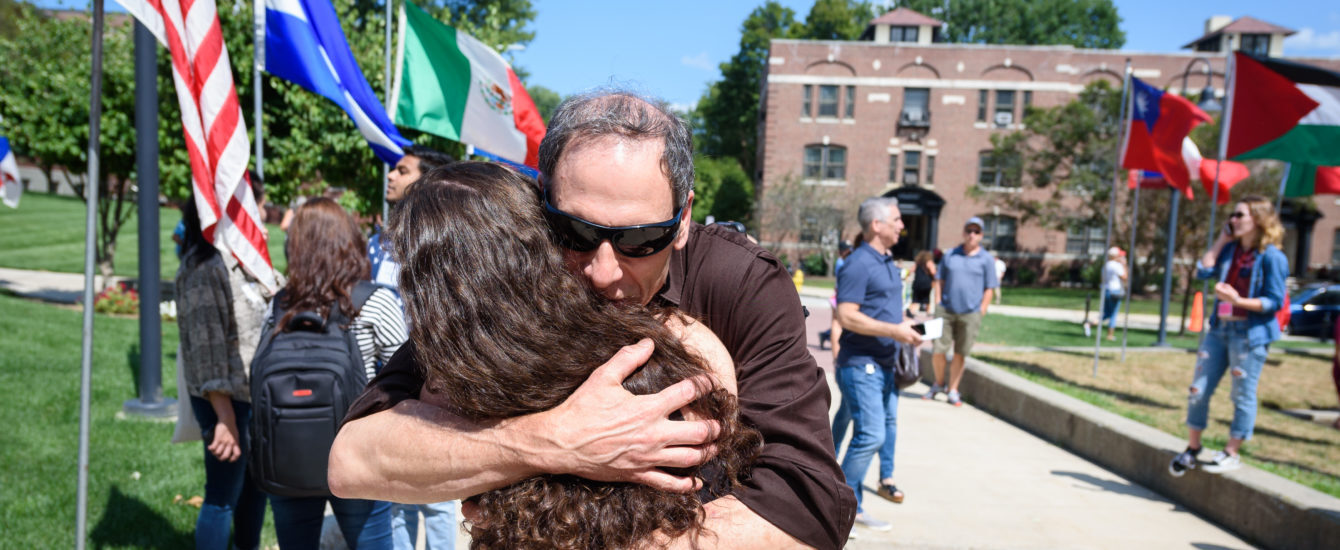 parent hugging their daughter