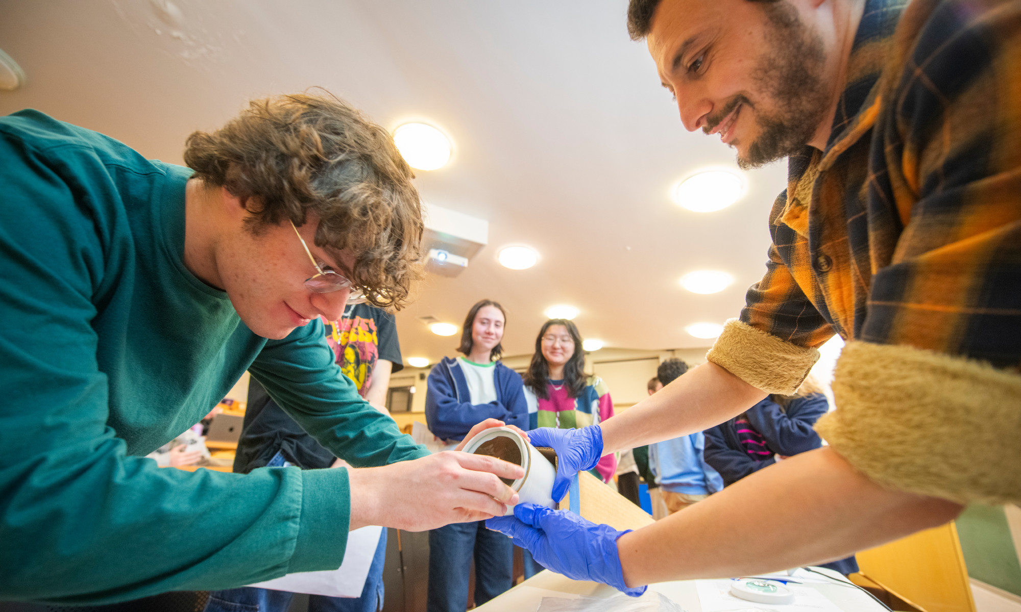 Students building telescope in "Exploring the Universe" class