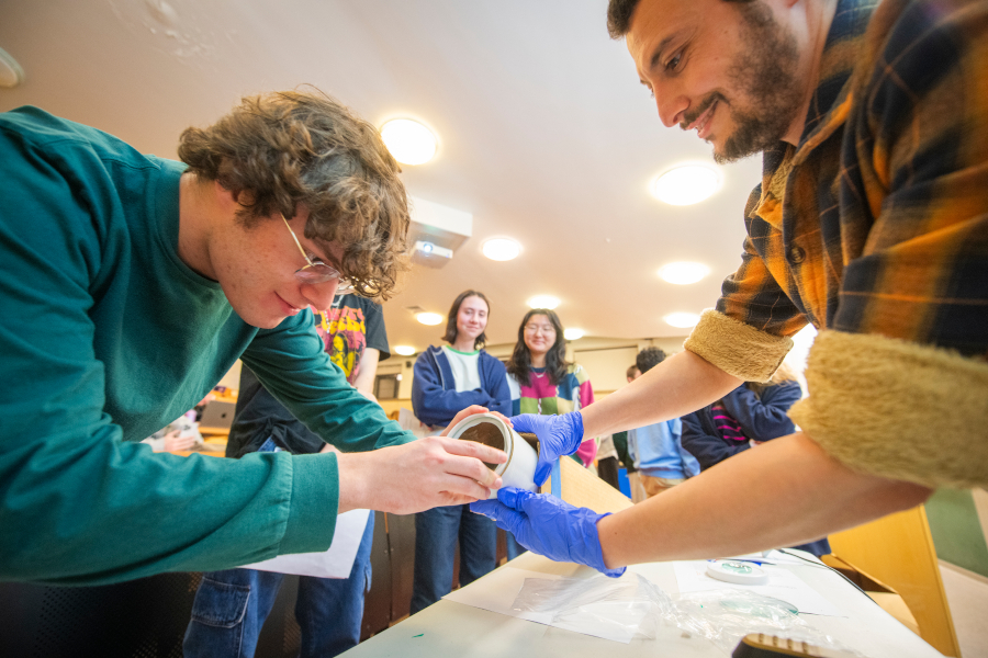 Students building telescope in 