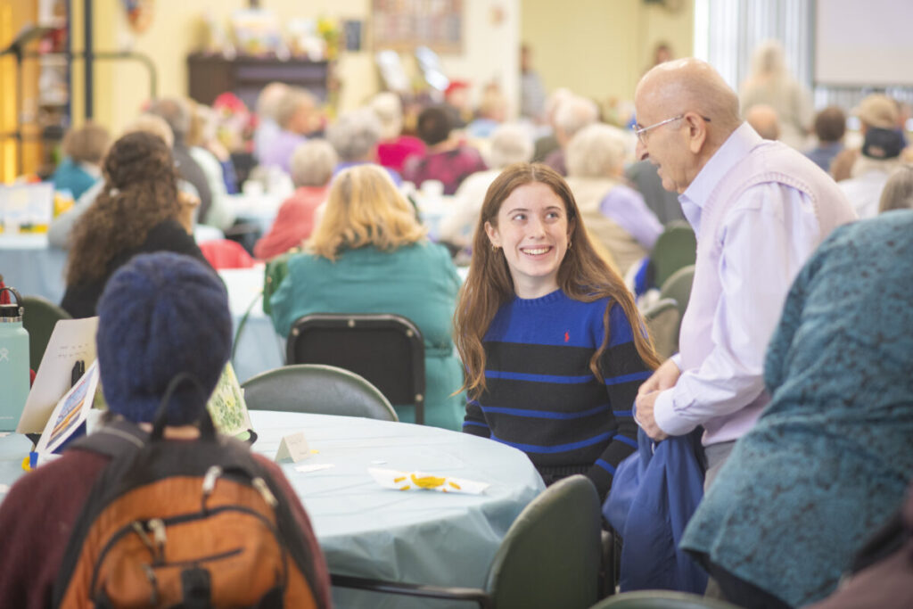 A student volunteers at the Worcester Senior Center.