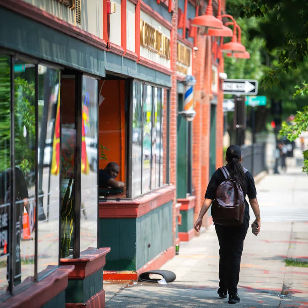 A student walks down Main Street
