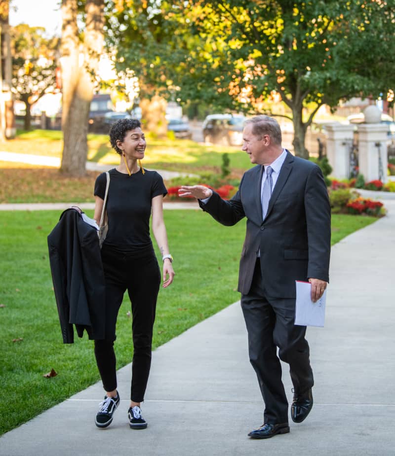 President Fithian escorts Dr. Chanda Prescod-Weinstein before she delivers her Presidential Lecture