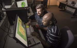 Student analyze a map on a display