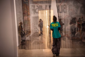 A studio art student looking at contemporary works during a field trip to the ICA, Boston