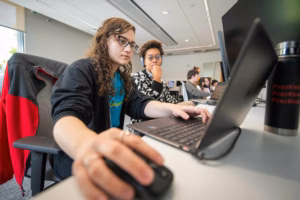 Students work on a project in a class on AI for gaming.