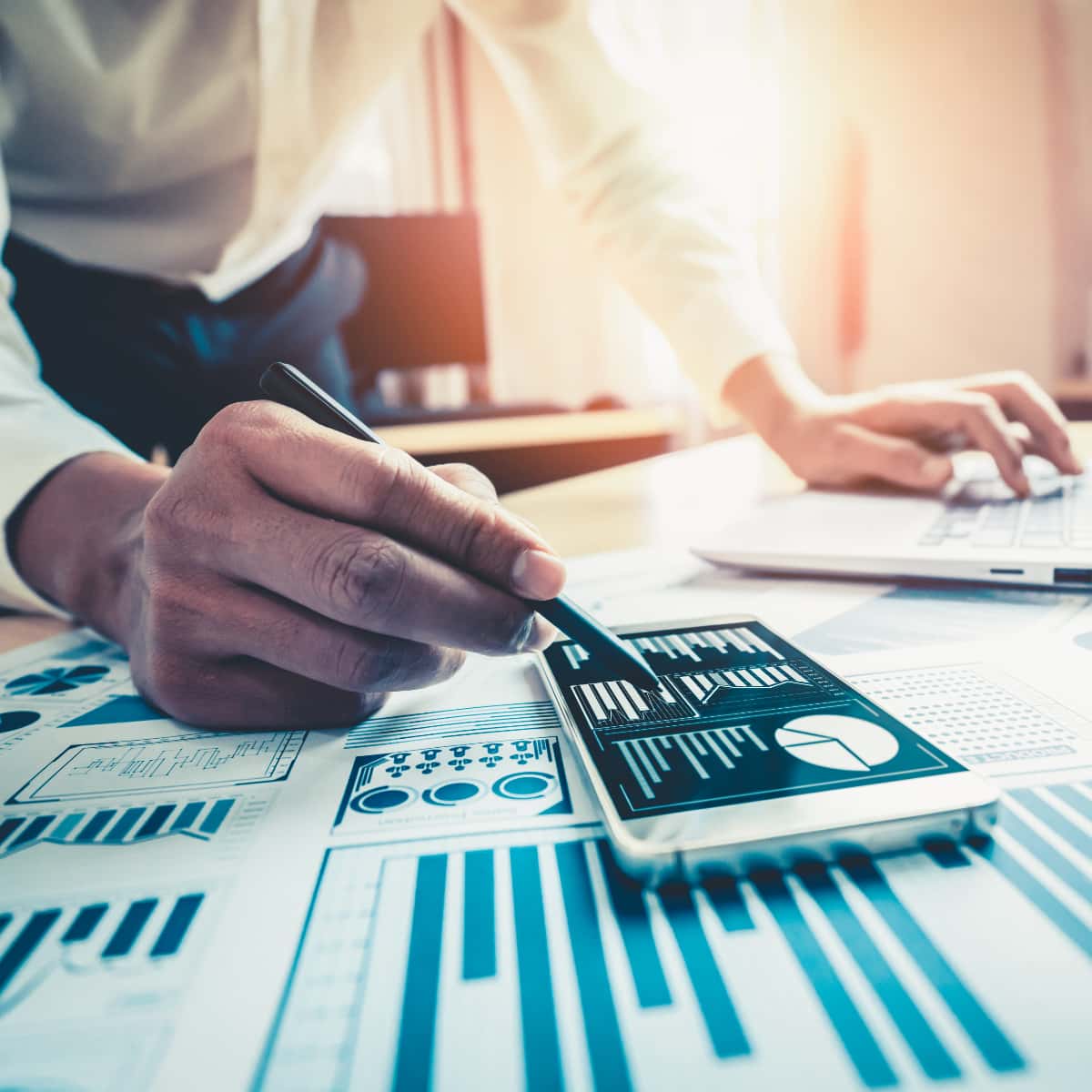 a man works with charts on his computer