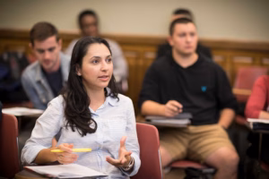 A student speaking in a class discussion, School of Professional Studies, Clark University