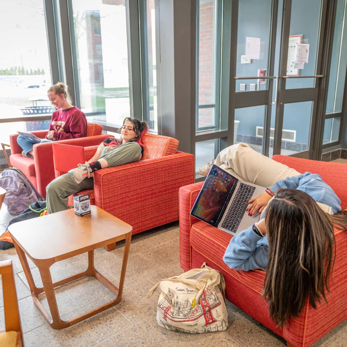 students study in the common area of Lasry
