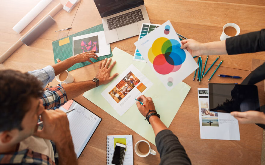 marketing professionals looking over graphics and ad spaces