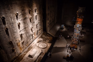 High Angle View of the Main Hall of the National September 11 Memorial, with the Last Column of the World Trade Center standing in the Center of the Room - Manhattan, New York City See Less