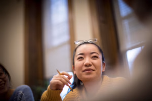 Clark School of Professional Studies students smiles during a classroom discussion