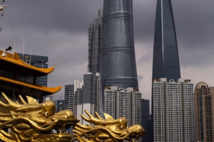 Traditional dragon motif in front of modern skyscrapers in a growing Shanghai skyline
