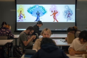 Students display their character concepts in a 2D drawing class